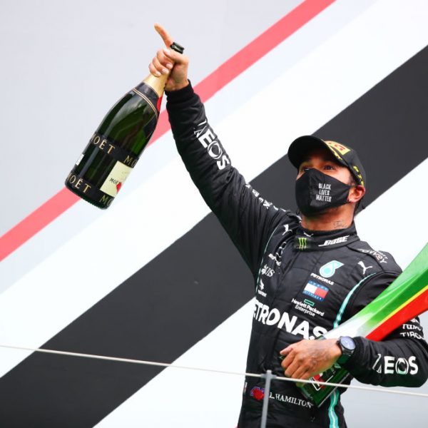 PORTIMAO, PORTUGAL - OCTOBER 25: Race winner Lewis Hamilton of Great Britain and Mercedes GP celebrates his record breaking 92nd race win on the podium during the F1 Grand Prix of Portugal at Autodromo Internacional do Algarve on October 25, 2020 in Portimao, Portugal. (Photo by Joe Portlock/Getty Images)